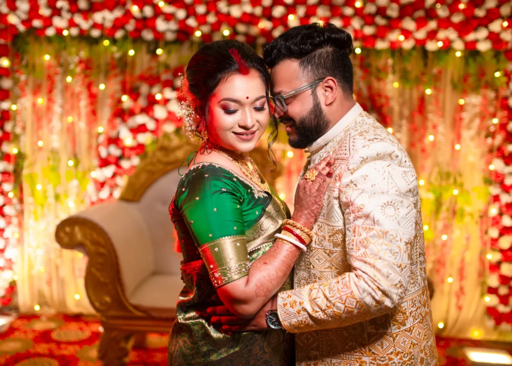 Bengali wedding couple portrait on decorated stage captured by Golden Memories Kolkata wedding photographer