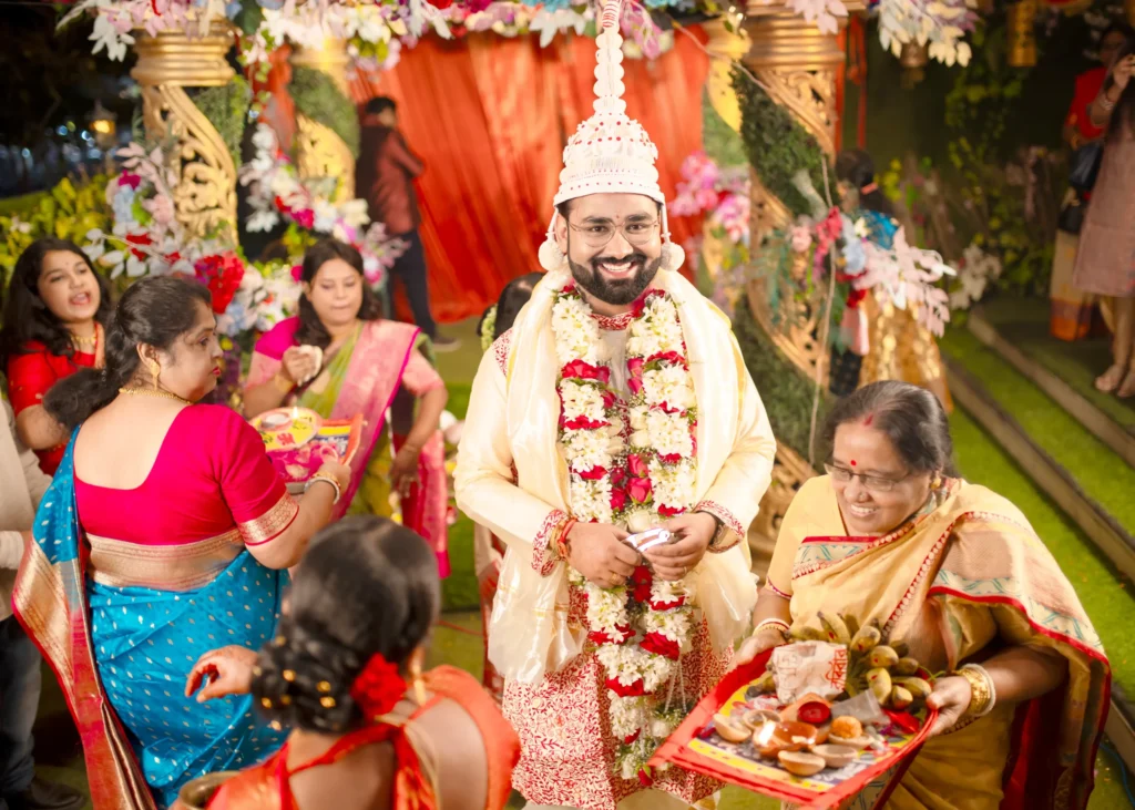 Traditional Bengali wedding groom entry ritual moment photographed in Kolkata