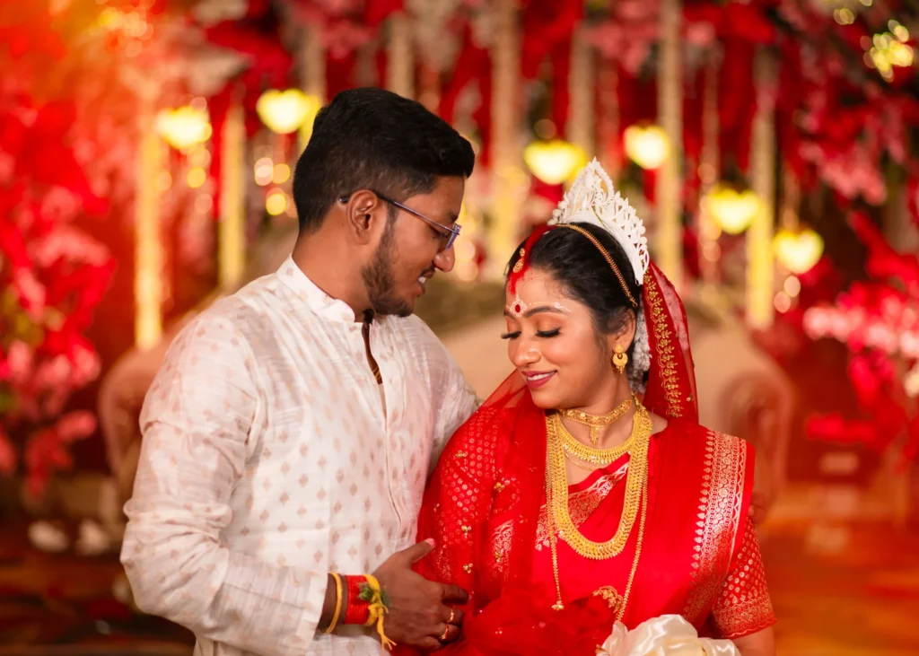 Elegant Bengali bride and groom portrait on wedding stage photographed by Kolkata wedding photographer
